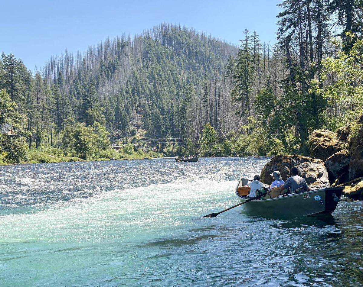 Drift boat on the turquoise water of the McKenzie River