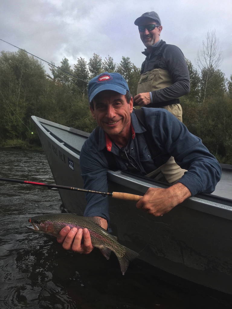 Two passengers on a McKenzie River drift boat tour